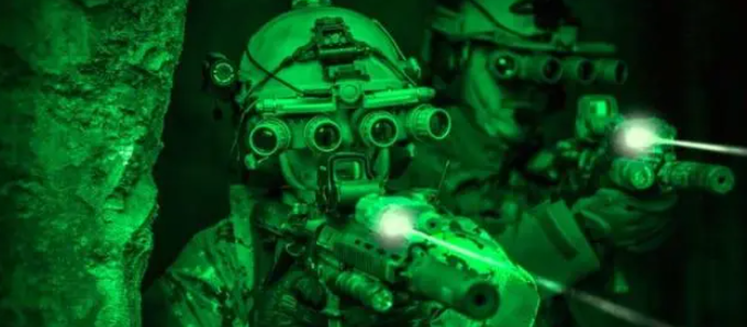 How important are night vision glasses to soldiers in making the night battlefield "transparent"?